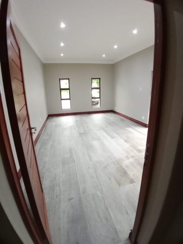 Bedroom floor tiles and wood skirting Aksium Projects