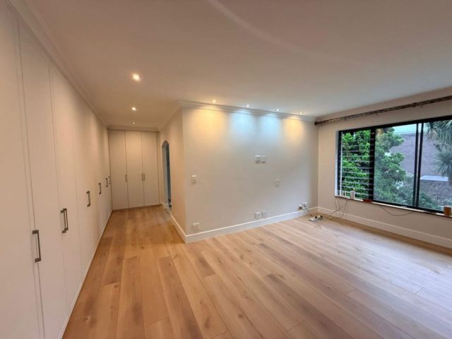 Luxury bedroom entrance with built in cupboards BIC Aksium Projects