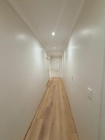 Hallway with floor tiles and finishing Aksium Projects