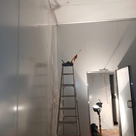 Wall installation in progress Aksium Projects