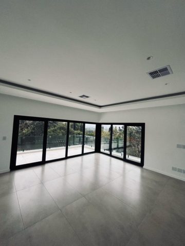 Large upstairs bedroom with doors Aksium Projects